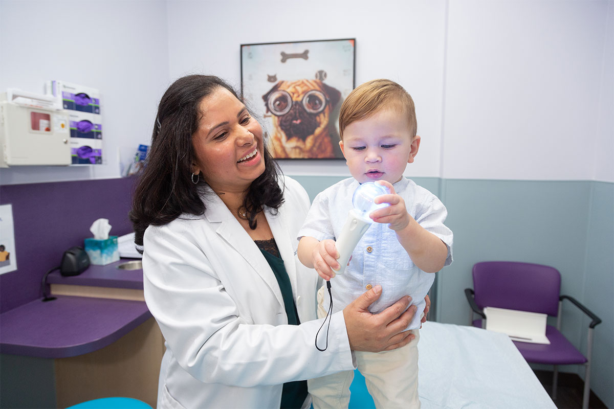 Dr. Kopalli with baby.