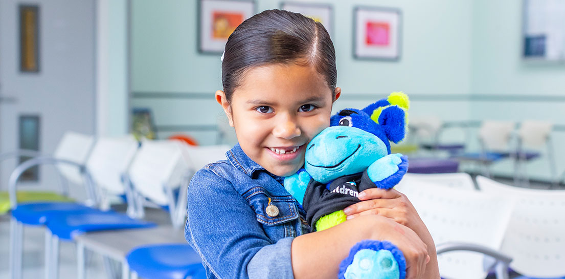 Girl holding peaks plushie