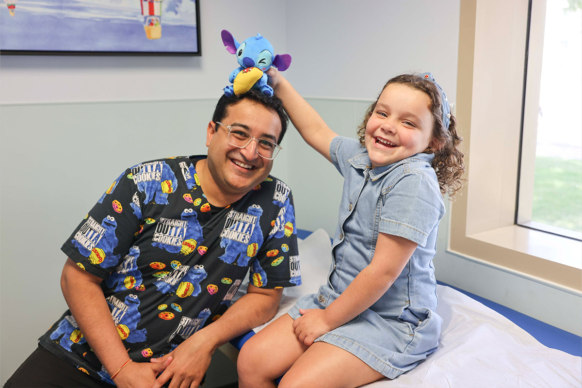 Dr. Bang with girl and plushie