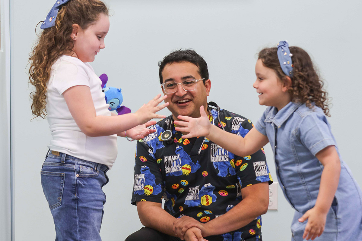 Dr. Bang Watching two girls shaking hands