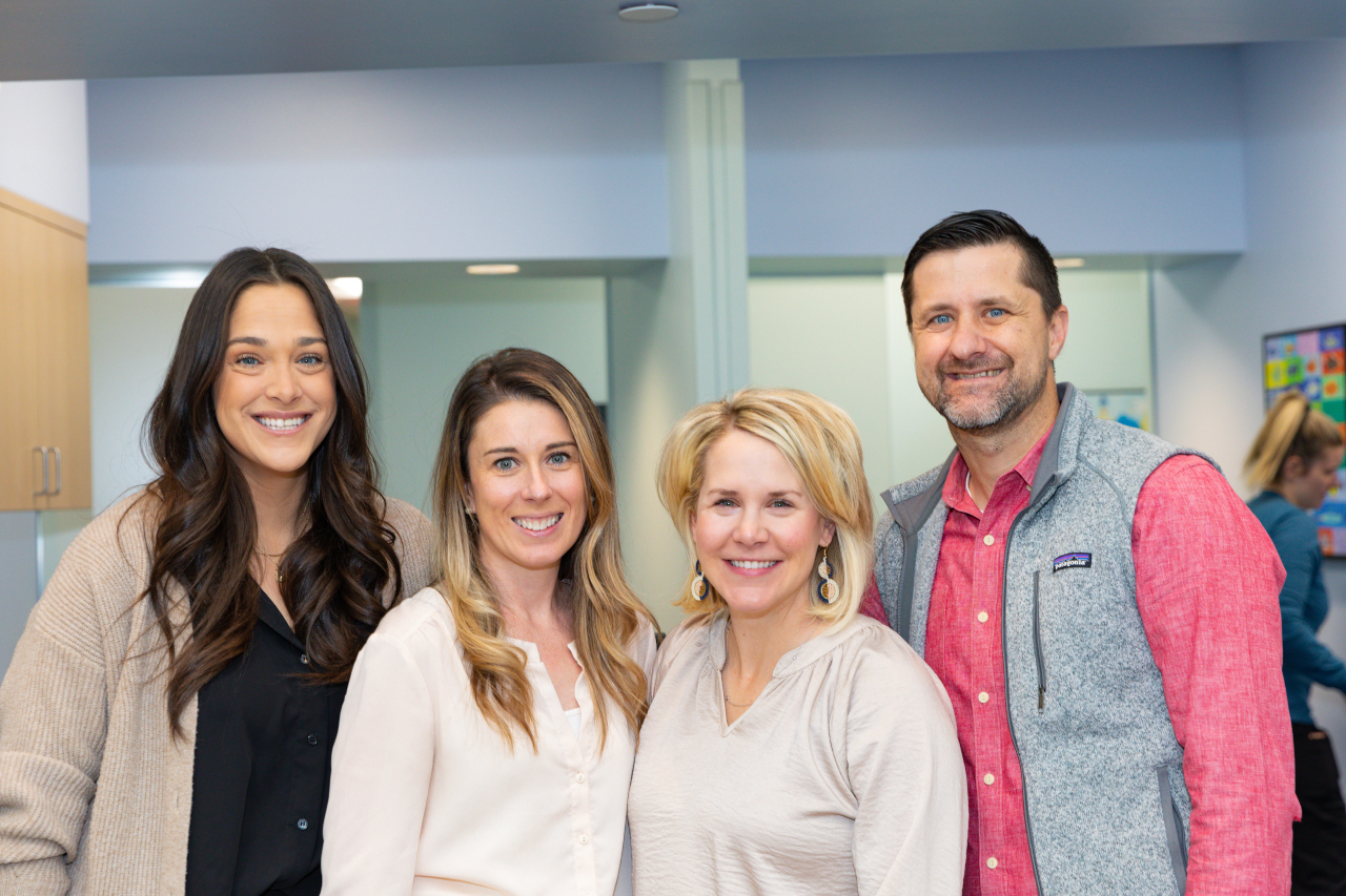 Nurse practitioner, Dr. Pena, office manager, and Dr. Smith in lobby