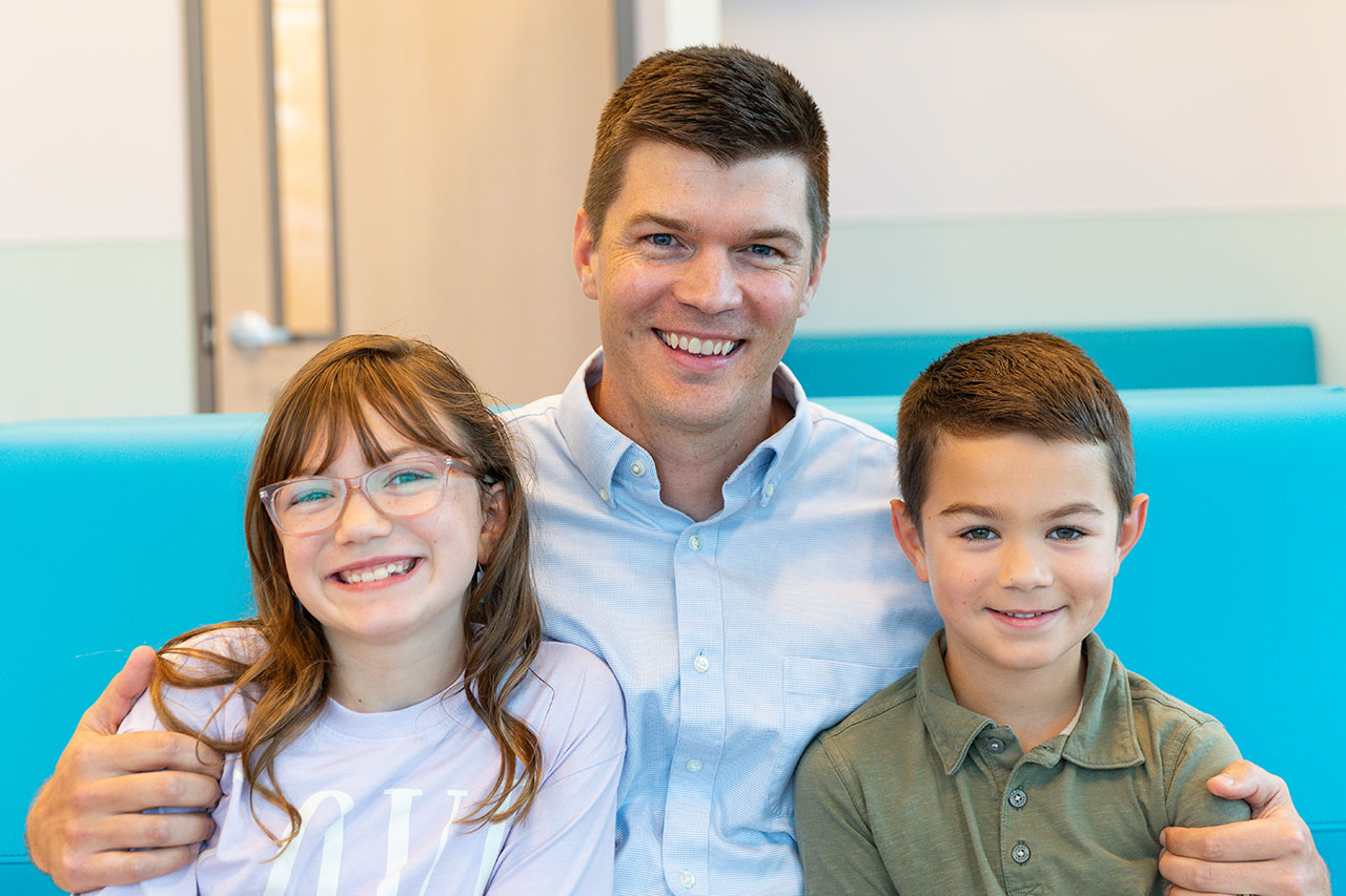 Dr. Gilmore with a boy and girl