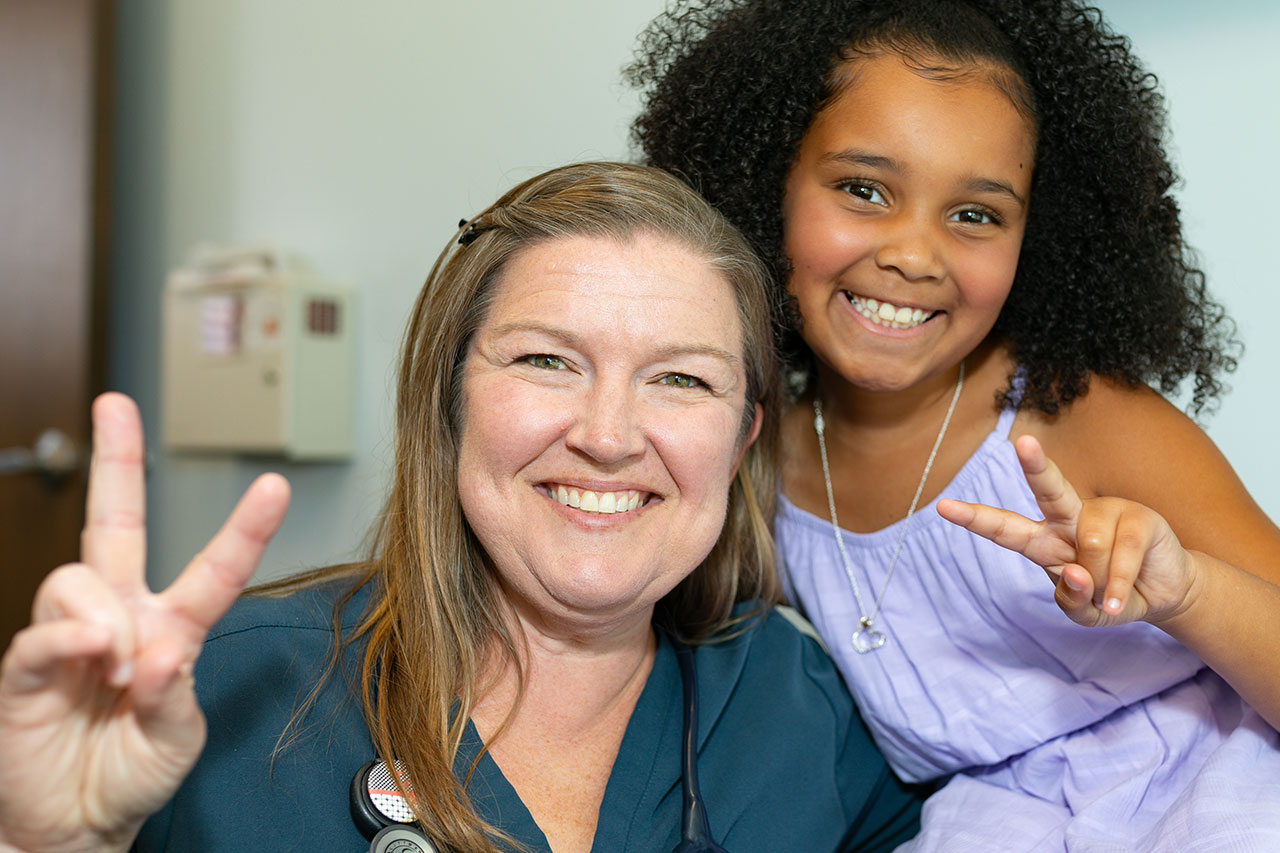 Dr. Piehl with girl.