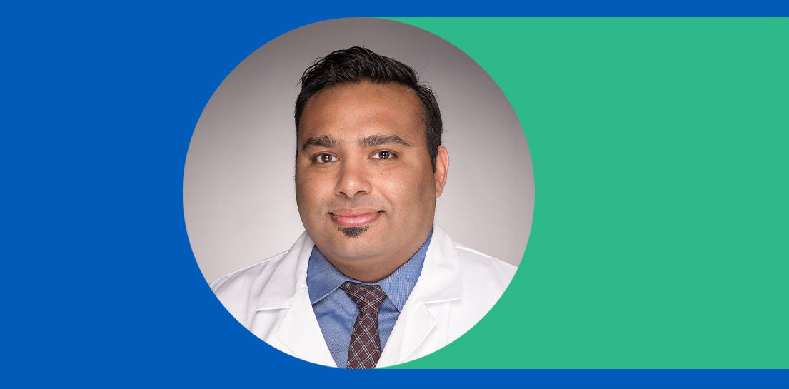 Photo of doctor wearing a blue shirt and plaid tie in the middle of blue and green background