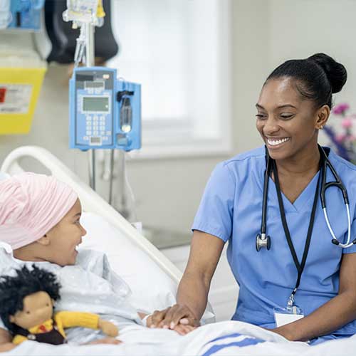 Nurse with child in bed