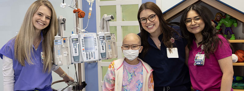 Three nurses with patient
