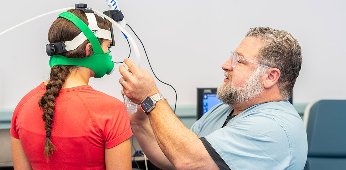 Pulmonologist and Endowed Chair John Robertson, M.D., with patient on treadmill