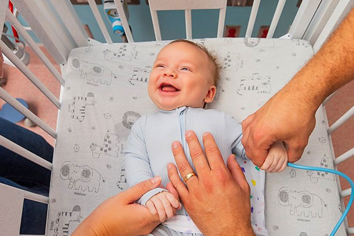 Smiling infant in NICU