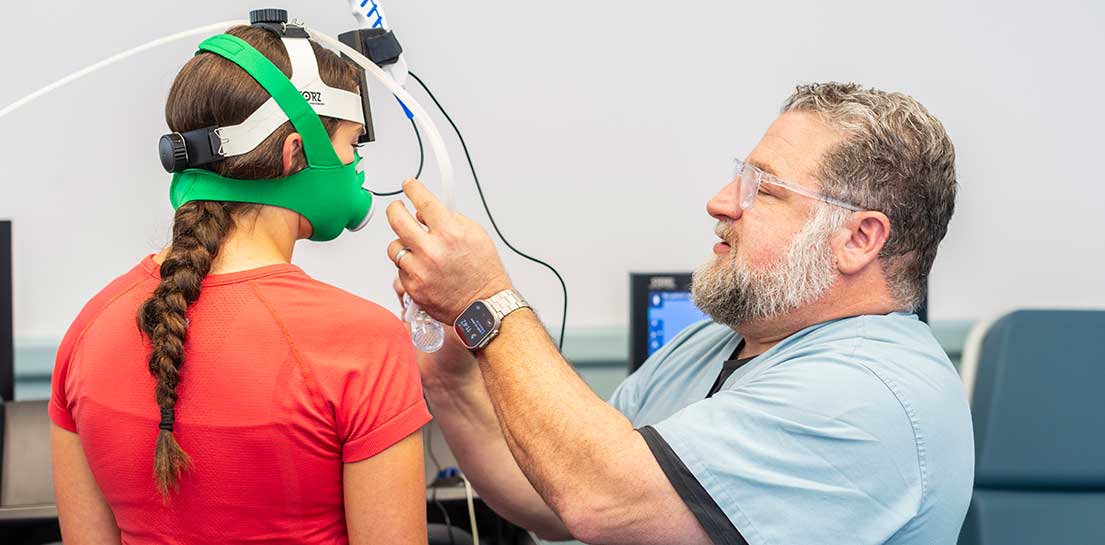 Doctor fitting diagnostic mask